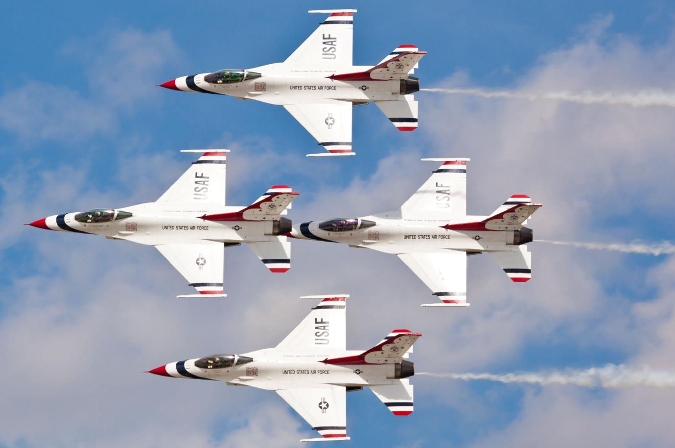 formation of the four USAF f-16 fighting falcons in the sky