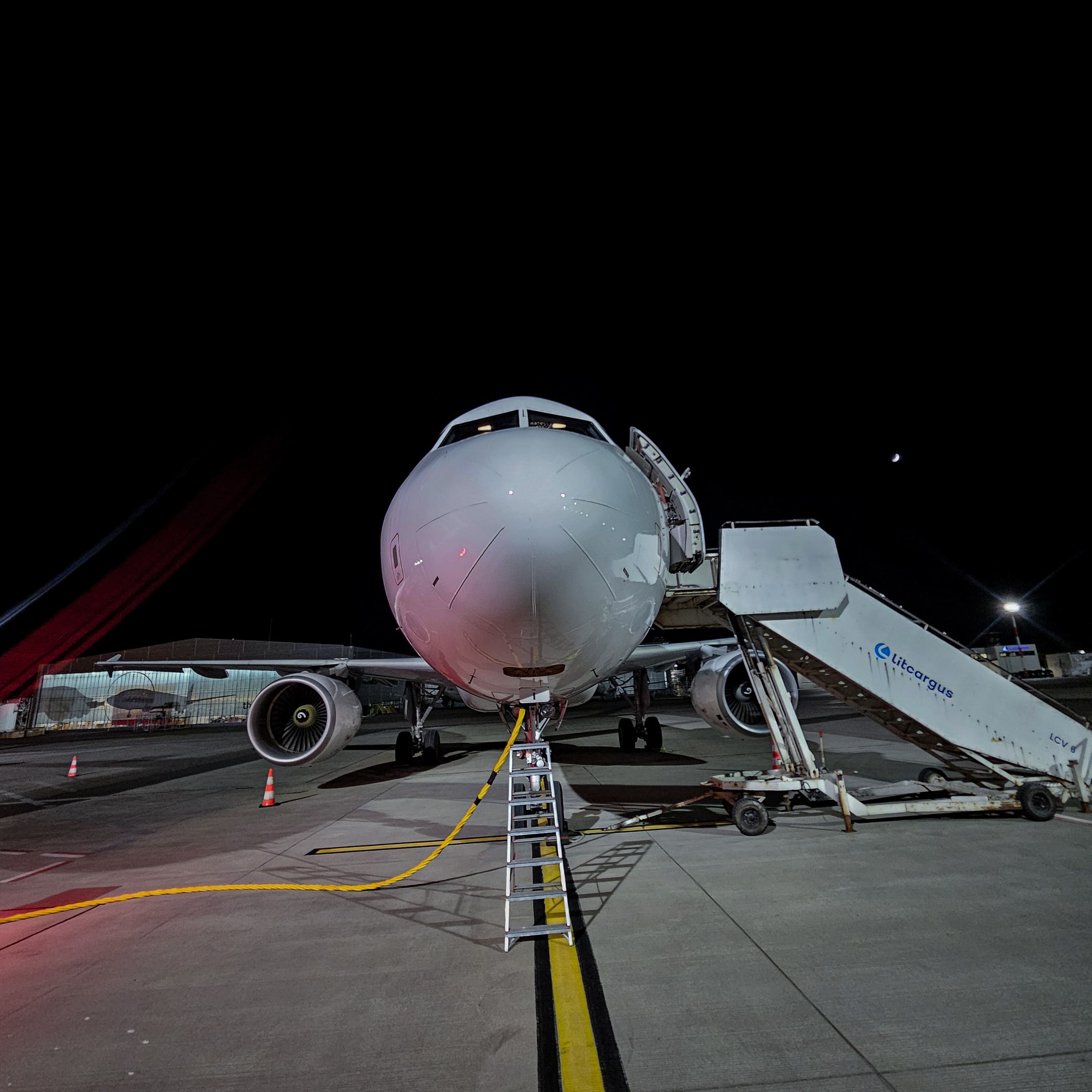 Airbus A320 aircraft from outside view in a dark