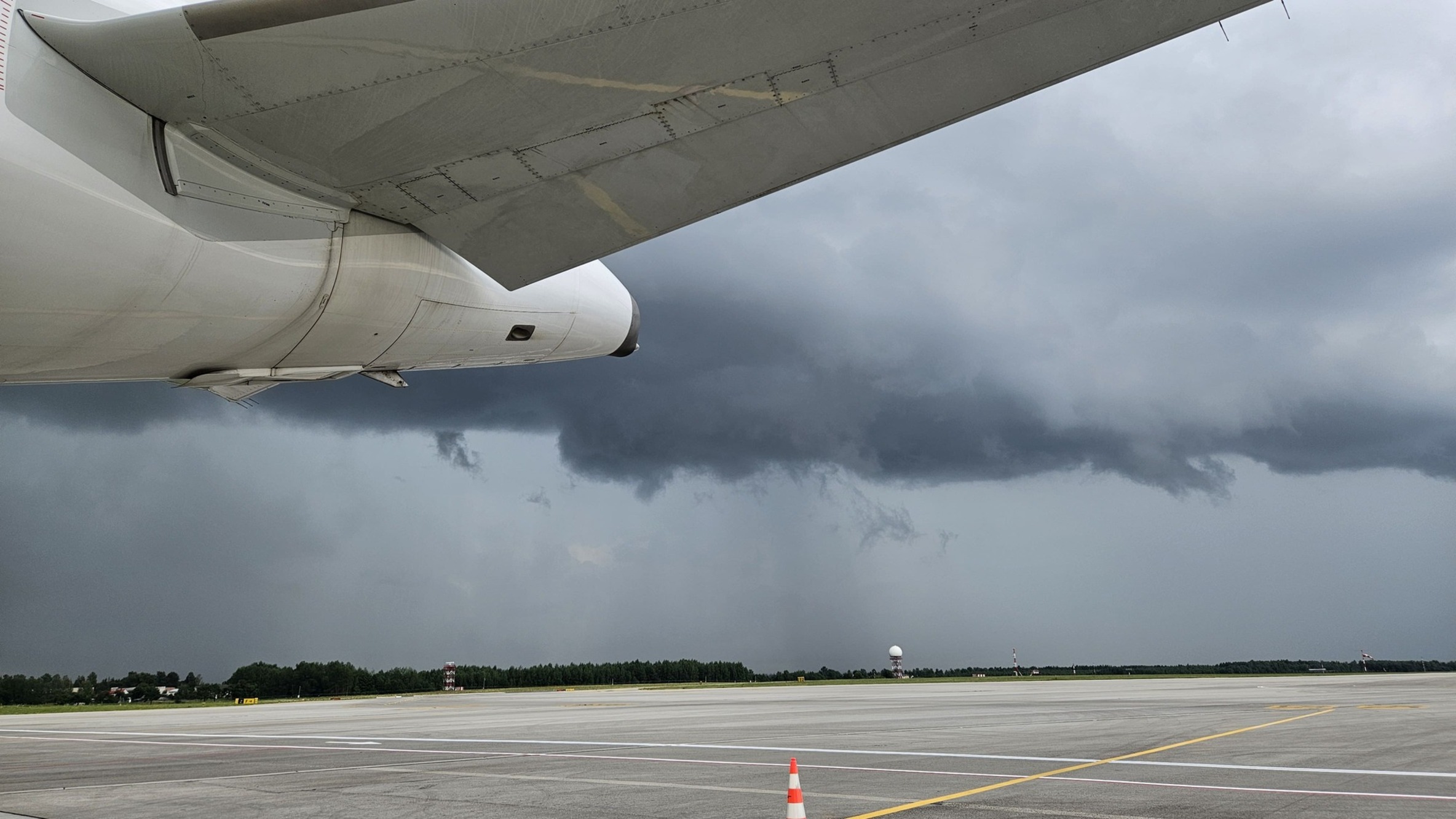 clouds forming behind an aircraft