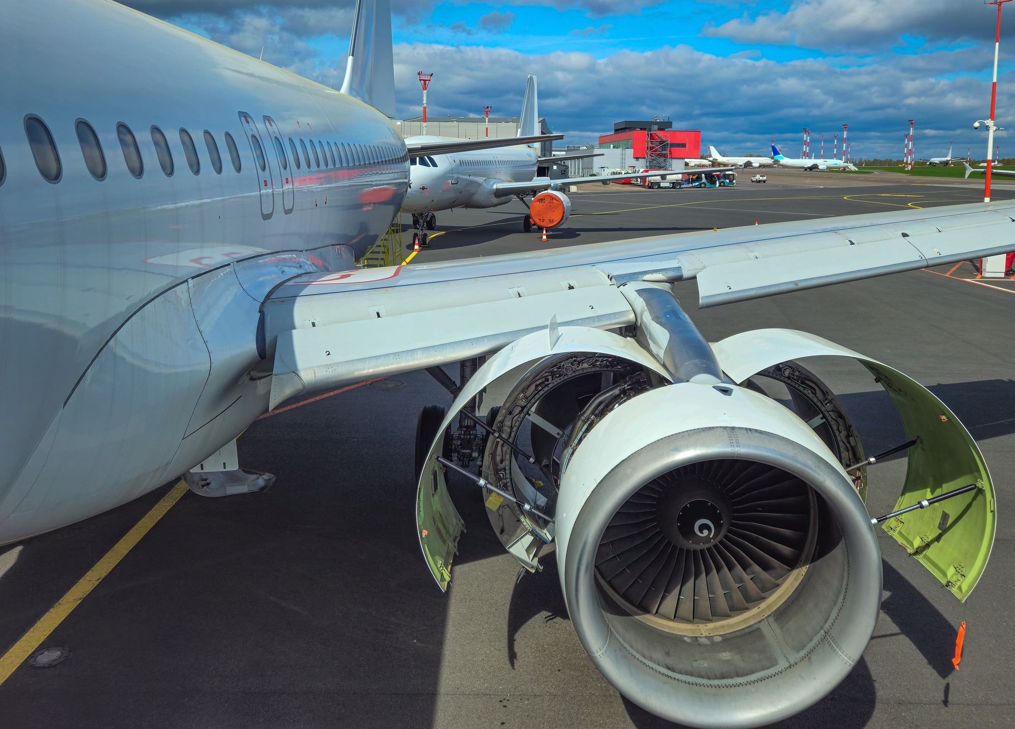 Airbus A320 with opened engine on a runway
