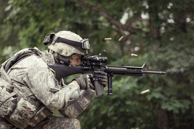 Side shot of soldier firing AR-15