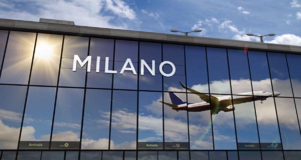 Arrival in the city with the glass airport terminal and reflection of the plane