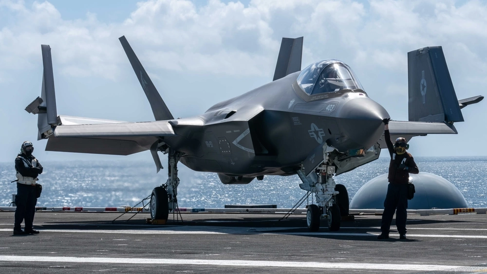 Sailors prepare to taxi an F-35C Lightning II