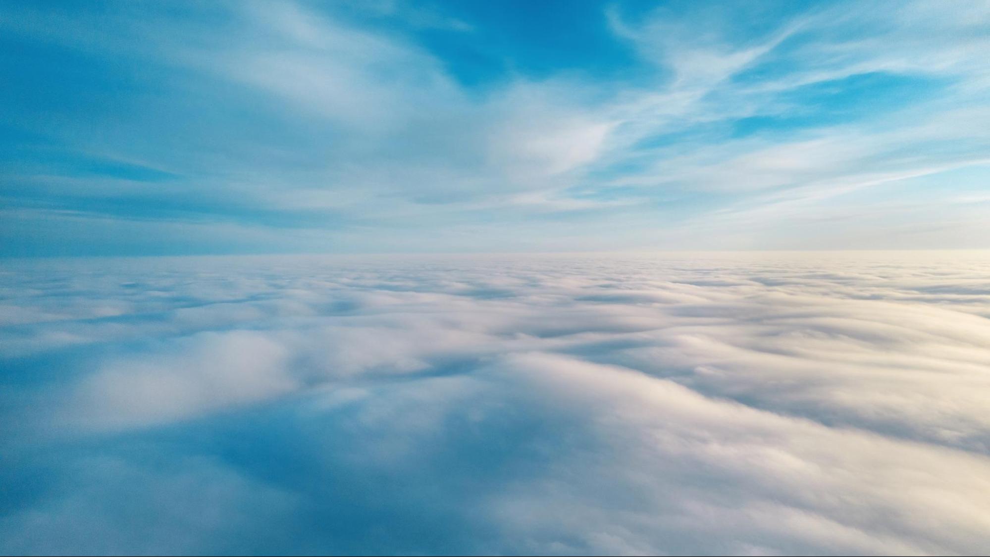 Aerial view from a drone flying above the clouds