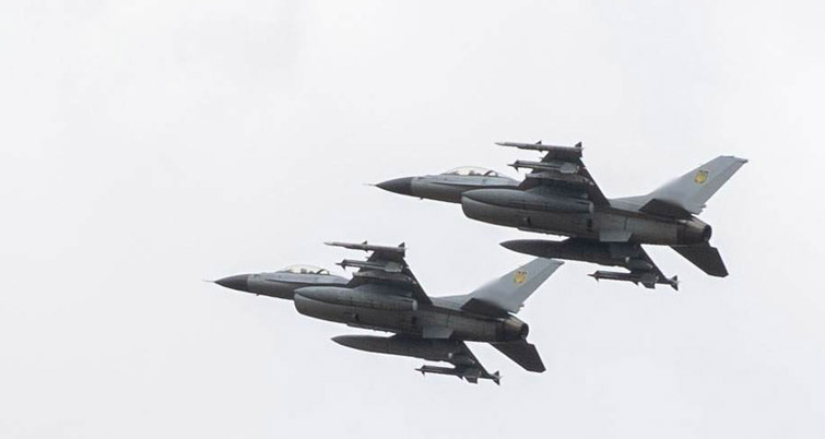 Two Ukranian F-16 Falcons soaring through the skies