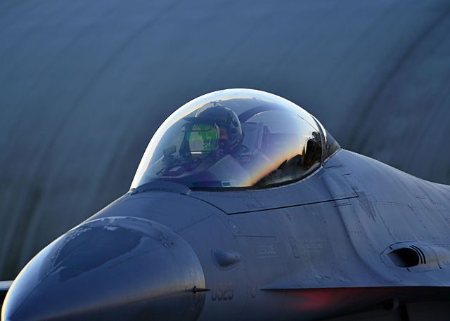 A US Air Force F-16 Fighting Falcon aircraft pilot prepares to depart Aviano Air Base, Italy, during a close air support training exercise